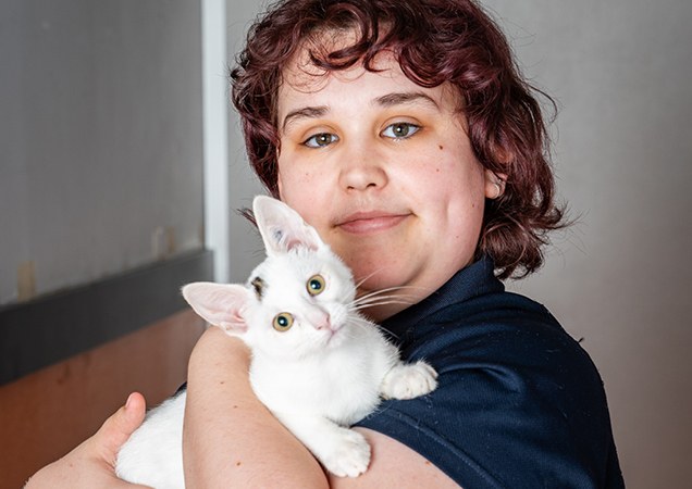 Volunteer Elizabeth with white cat.